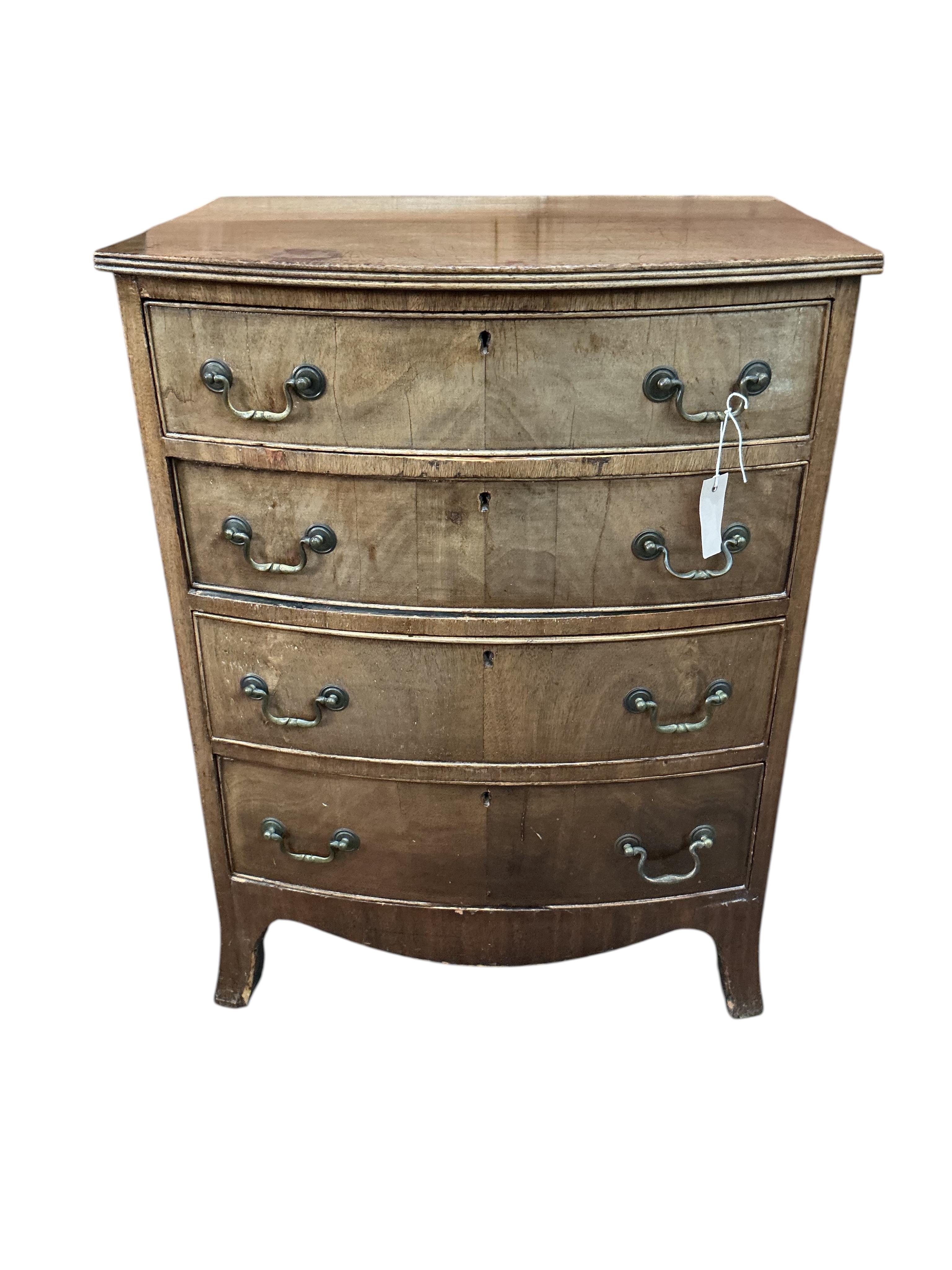 A small Regency style bow front four drawer mahogany chest, width 64cm, depth 48cm, height 84cm